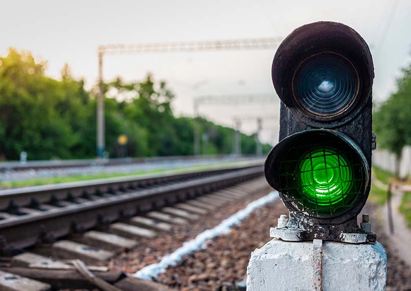 Green traffic light on railroad